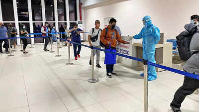 Passengers undergo thermal screening at the Delhi airport.