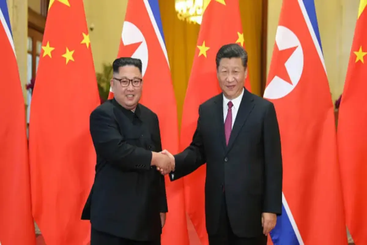 Kim Jong-un with Xi Jinping