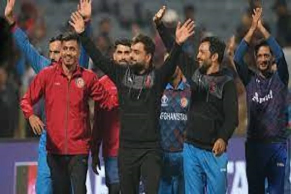 The Afghan cricket team acknowledges the Pune crowd's applause.