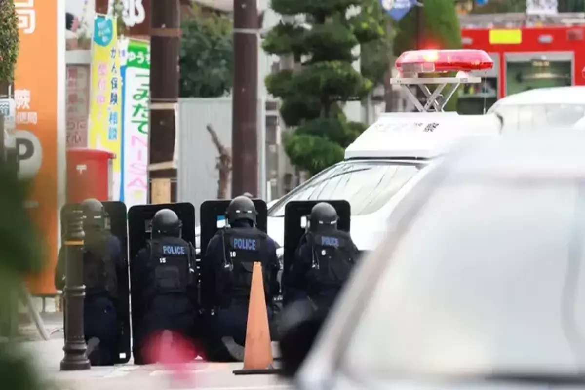 300 locals are ordered to flee after a gunman storms Japan post office