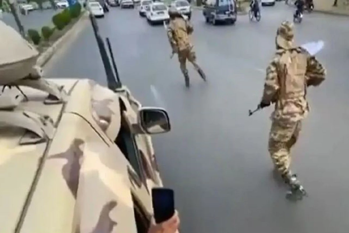 Video: Taliban members patrol Kabul streets on rollerblades armed with AK-47 rifles