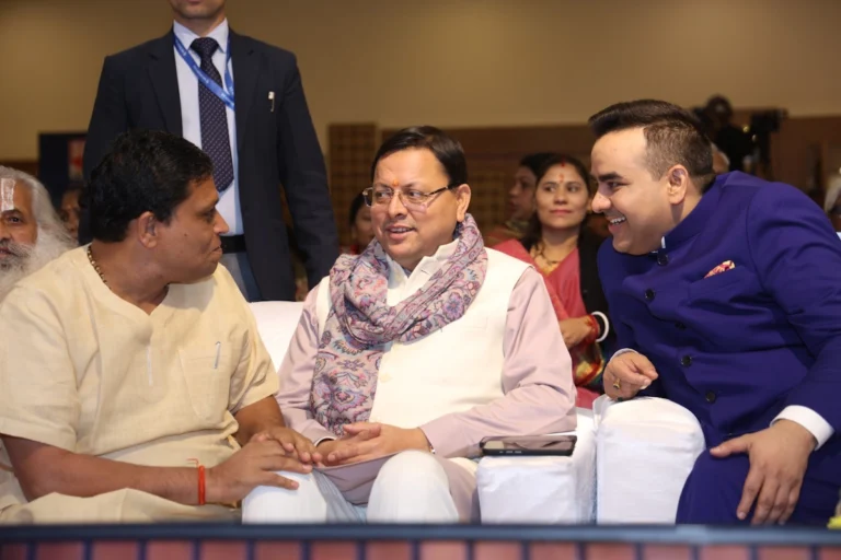 CM Pushkar Singh Dhami, Acharya Balkrishna of Patanjali Ayurveda, and CMD Upendrra Rai of Bharat Express at the Uttarakhand Conclave.