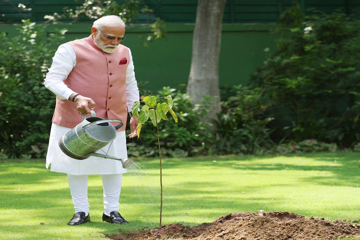 PM Modi Plants ‘Sindoor’ Sapling Gifted By 1971 War Heroes On World Environment Day